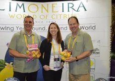 John Caragliano, Tara Saldana and John Carter with Limoneira show pink lemons and a pouch bag with a lemon trio.